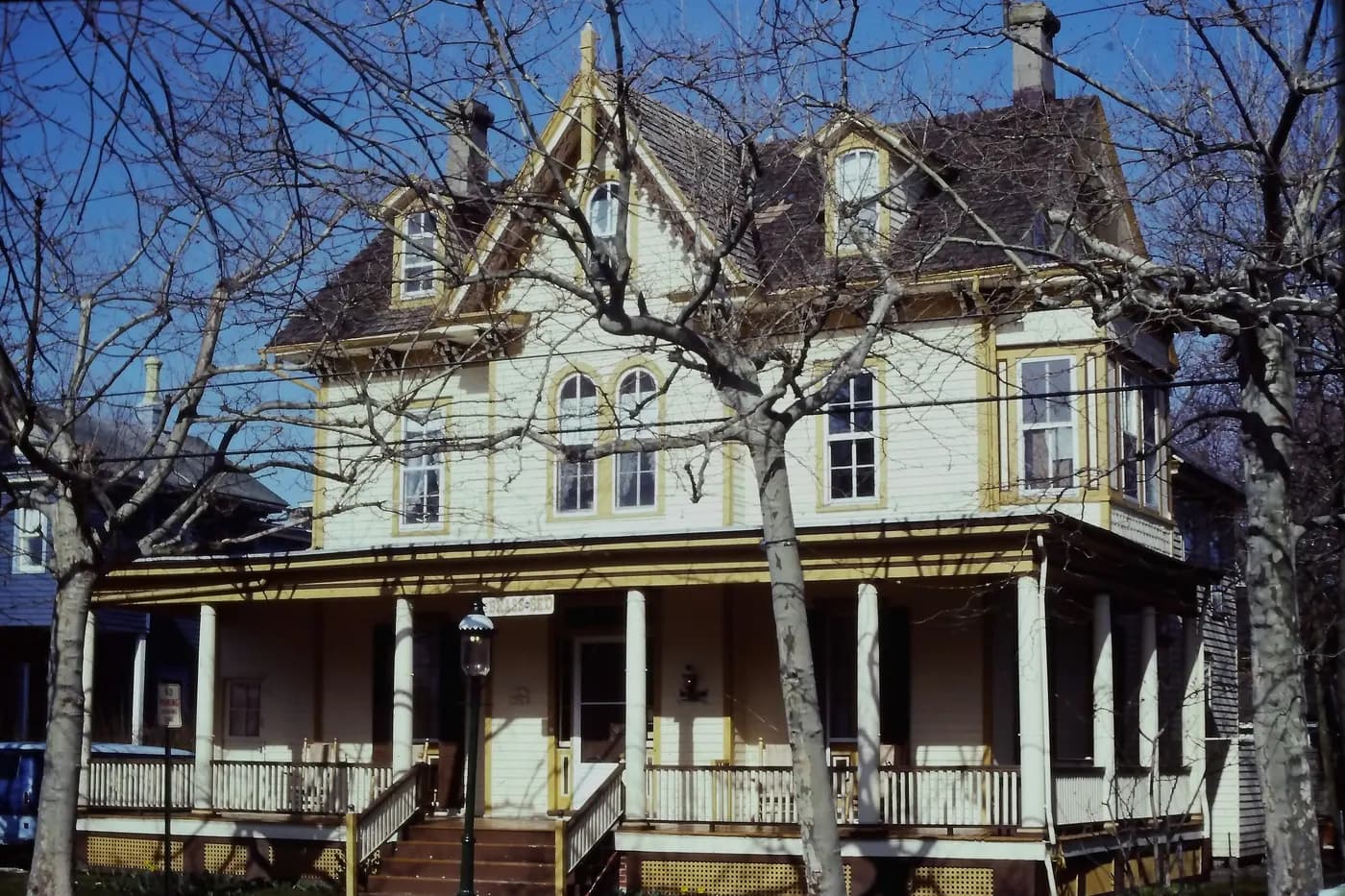 An 1872 house on Columbia Avenue in Cape May, New Jersey, with a steep gabled roof, chimney and later porch