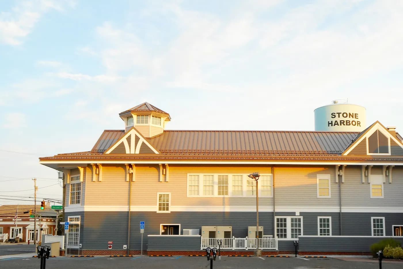The Stone Harbor library, with a metal roof and rooftop cupola, soon after sunrise in Stone Harbor, New Jersey