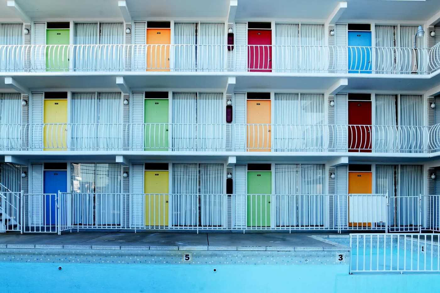 The balconies and brightly painted doors of a historic motel in Wildwood, New Jersey